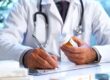 doctor writing prescription in medication assisted treatment program